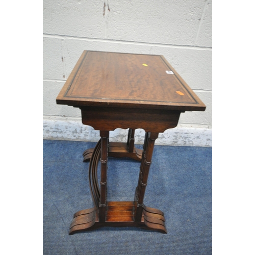 1209 - A REPRODUCTION MAHOGANY QUARTETTO NEST OF FOUR TABLES, raised on turned legs, shaped feet, united by... 