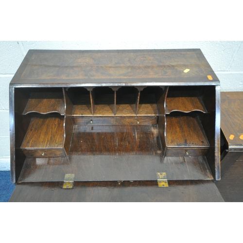 1214 - AN EARLY 20TH CENTURY WALNUT BUREAU, the fall front door enclosing a fitted interior, above a single... 