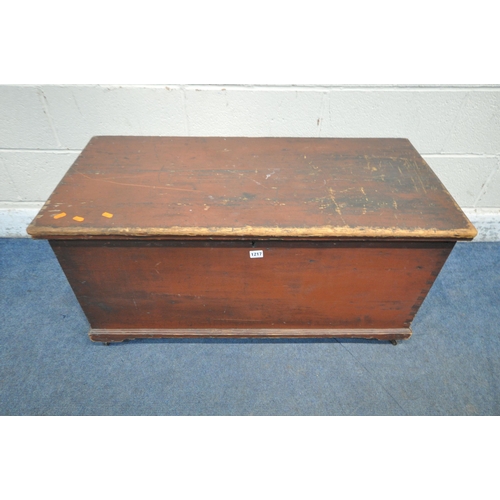 1217 - A STAINED PINE CHEST, with twin rope handles, the hinged lid enclosing a candle box, with two drawer... 