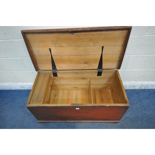 1217 - A STAINED PINE CHEST, with twin rope handles, the hinged lid enclosing a candle box, with two drawer... 