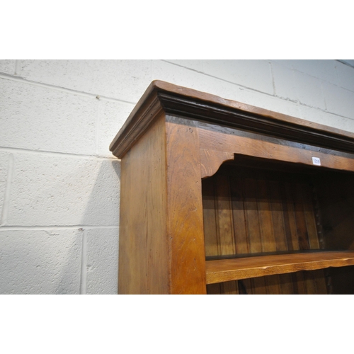 1219 - A HARDWOOD OPEN BOOKCASE, with four adjustable shelves, above two drawers, width 104cm x depth 40cm ... 