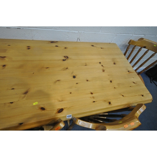 1220 - A MODERN PINE RECTANGULAR KITCHEN TABLE, raised on turned legs, length 152cm x depth 77cm x height 7... 