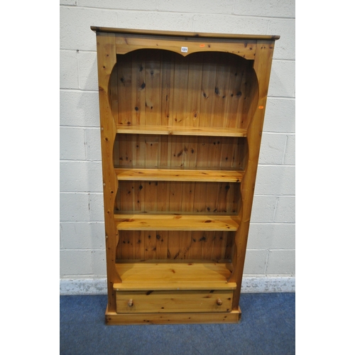 1221 - A MODERN PINE OPEN BOOCKASE, fitted with three shelves, above a single drawer, width 93cm x depth 30... 