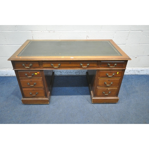 1223 - A 20TH CENTURY MAHOGANY TWIN PEDESTAL DESK, with a green leather writing surface, and nine assorted ... 