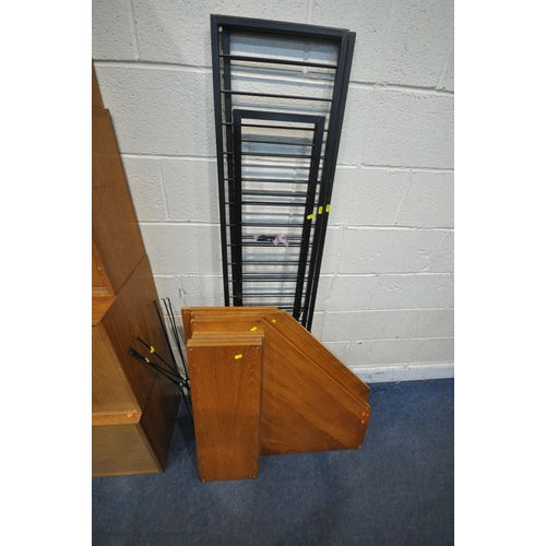 1227 - A STAPLES MODULAR LADDERAX SYSTEM, comprising two uprights, a section with a fall front door, one wi... 