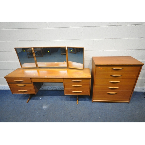 1228 - AN AUSTINSUITE MID CENTURY TEAK DRESSING TABLE, with a triple mirror, seven assorted drawers, raised... 