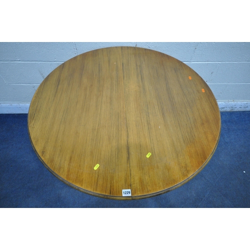 1229 - A MARKS AND SPENCER SINGLE PEDESTAL EXTENDING DINING TABLE, with a single fold out leaf, diameter 10... 