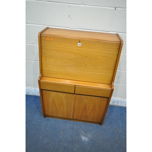 1230 - REMPLOY, A MID CENTURY TEAK BUREAU, the fall front door enclosing a fitted interior, above two drawe... 