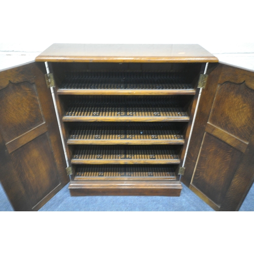 1245 - POSSIBLY TITCHMARSH AND GOODWIN, A GOOD QUALITY OAK DOUBLE DOOR CD RACK, width 74cm x depth 25cm x h... 