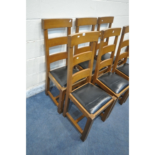 1250 - A SET OF SIX OAK DINING CHAIRS, with black leather seats (condition report: marks, scuffs, a couple ... 