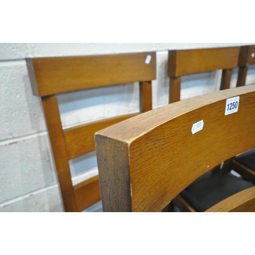 1250 - A SET OF SIX OAK DINING CHAIRS, with black leather seats (condition report: marks, scuffs, a couple ... 