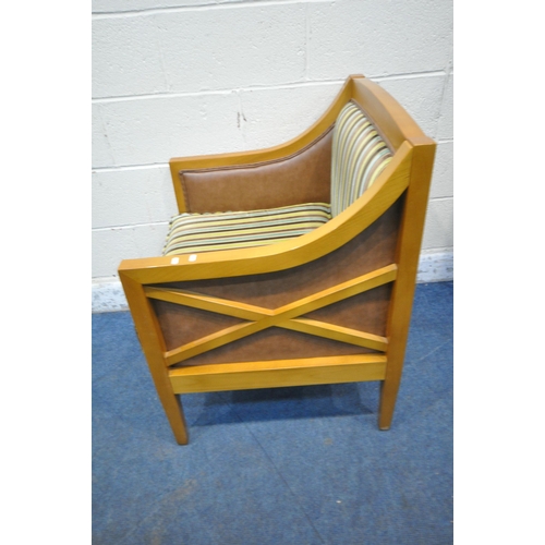 1268 - A MODERN BEECH FRAMED ARMCHAIR, with stripped back rest and seat, brown leatherette sides, raised on... 