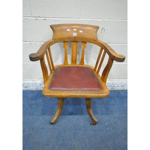 1273 - A 20TH CENTURY OAK OFFICE CHAIR, with swept armrests, oxblood leather seat pad, raised on four shape... 