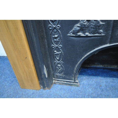 1279 - A MODERN CAST IRON FIREPLACE, with a wooden surround, width 87cm x depth 33cm x height 110cm (condit... 