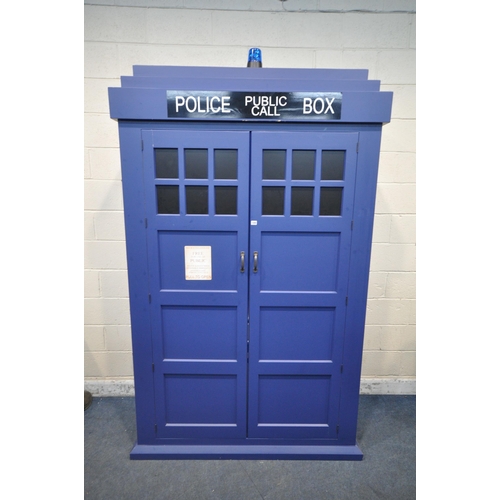 1289 - A LARGE WARDROBE IN THE FORM OF THE TARDIS FROM DOCTOR WHO, with double doors, that are enclosing a ... 