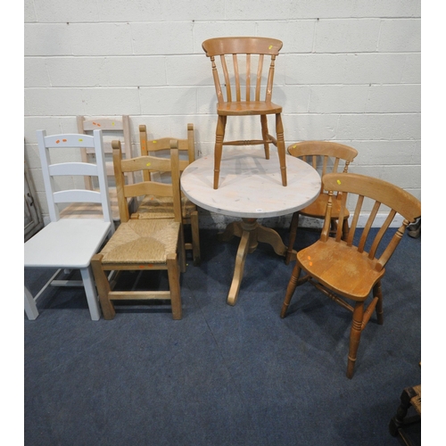 1293 - A PARTIALLY PAINTED PINE CIRCULAR PEDESTAL TABLE, diameter 92cm x height 76cm, a set of three chairs... 