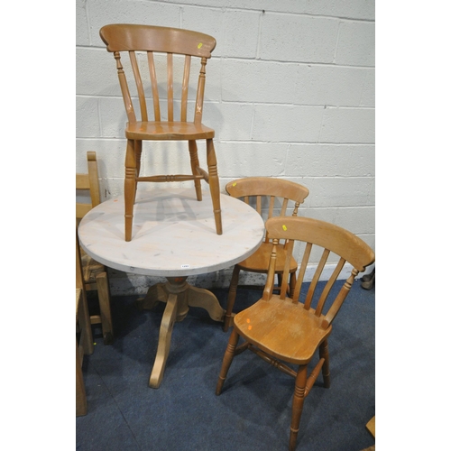 1293 - A PARTIALLY PAINTED PINE CIRCULAR PEDESTAL TABLE, diameter 92cm x height 76cm, a set of three chairs... 