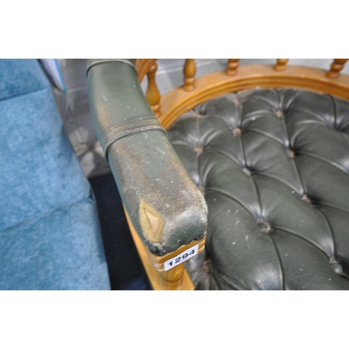 1294 - A REPRODUCTION GREEN BUTTONED LEATHER UPHOLSTERED SWIVEL ARMCHAIR, on a later base, width 63cm x dep... 