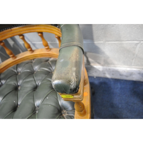 1294 - A REPRODUCTION GREEN BUTTONED LEATHER UPHOLSTERED SWIVEL ARMCHAIR, on a later base, width 63cm x dep... 