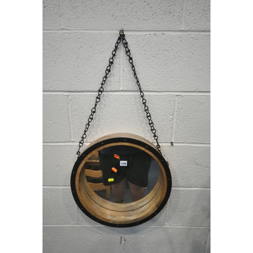 1296 - A DECORATIVE CIRCULAR WALL MIRROR, with a long chain, diameter 45cm, an oak dressing mirror, along w... 