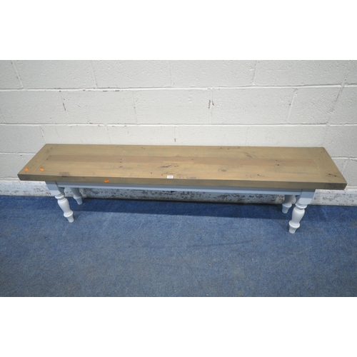 1301 - A PARTIALLY PAINTED WOODEN BENCH, raised on turned legs (condition report: general signs of usage)