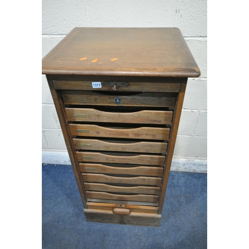 1313 - A 20TH CENTURY OAK TAMBOUR FRONT FILING CABINET, enclosing nine drawers, labelled Crusader office fu... 