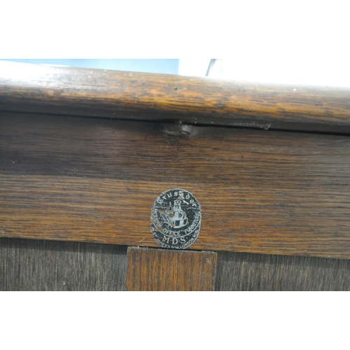 1313 - A 20TH CENTURY OAK TAMBOUR FRONT FILING CABINET, enclosing nine drawers, labelled Crusader office fu... 