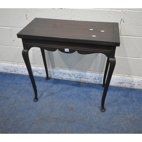 1320 - A 20TH CENTURY MAHOGANY TEA TABLE, the swivel fold over top enclosing a small storage section, a wav... 