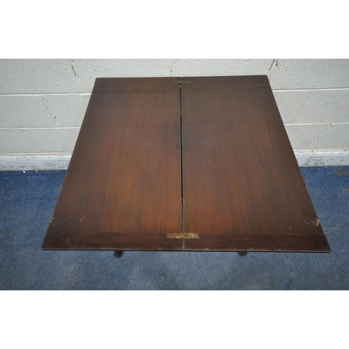 1320 - A 20TH CENTURY MAHOGANY TEA TABLE, the swivel fold over top enclosing a small storage section, a wav... 