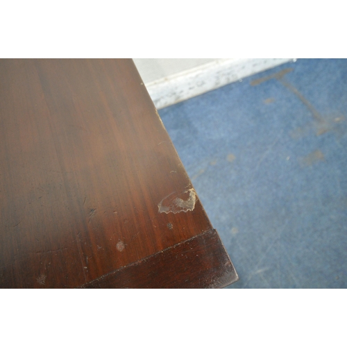 1320 - A 20TH CENTURY MAHOGANY TEA TABLE, the swivel fold over top enclosing a small storage section, a wav... 