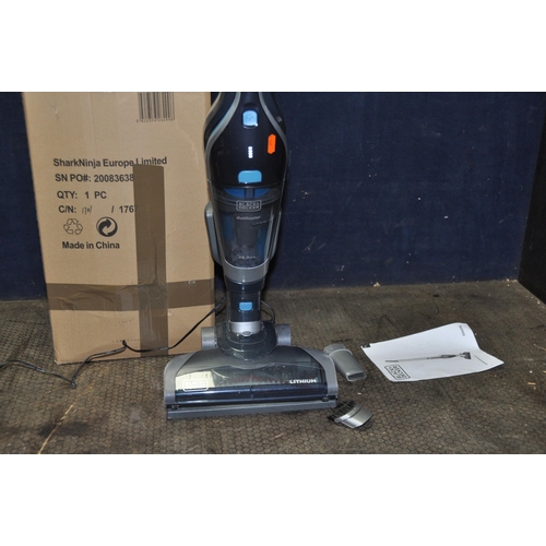 1054 - A BLACK AND DECKER CORDLESS DUST BUSTER VACUUM CLEANER with stand and charger (PAT pass and working)