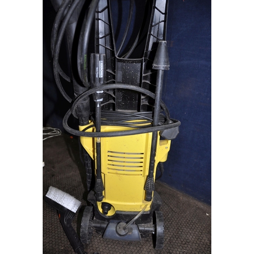 1055 - A KARCHER K2.400 PRESSURE WASHER with lance, five nozzles including a car brush and patio head (PAT ... 