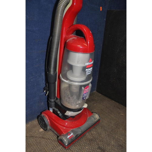 1067 - A BISSELL POWER GROOM COMPACT UPRIGHT VACUUM CLEANER (PAT pass and working) and a Flymo lawn mower (... 