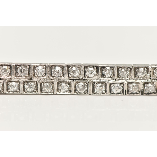 11 - A DIAMOND BROOCH, of rectangular outline, set with two rows of old cut diamonds each within a square... 