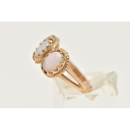 14 - A 9CT GOLD OPAL RING, designed as three oval opal cabochons within claw settings and outer rope twis... 