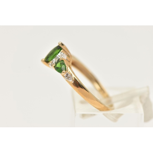 15 - A 9CT GOLD GEM RING, designed as a central marquise shape green gem flanked by single cut diamonds a... 