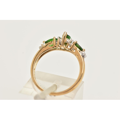 15 - A 9CT GOLD GEM RING, designed as a central marquise shape green gem flanked by single cut diamonds a... 