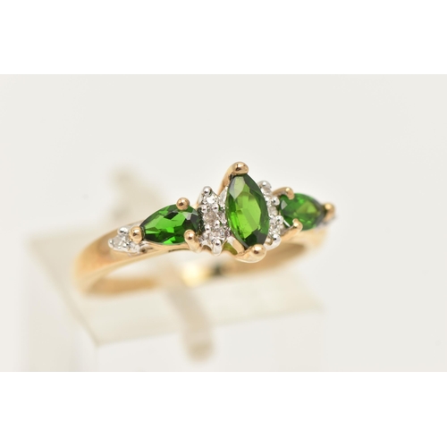 15 - A 9CT GOLD GEM RING, designed as a central marquise shape green gem flanked by single cut diamonds a... 