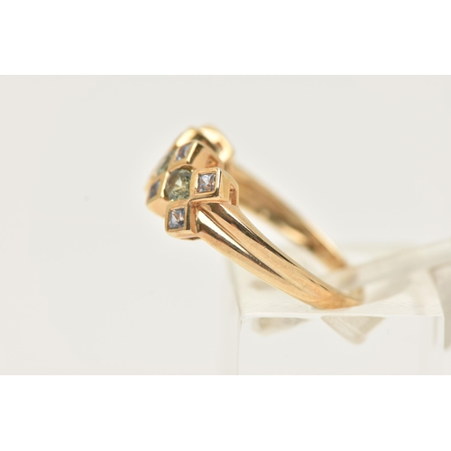 18 - A 9CT GOLD GEM SET RING, designed as a line of three oval cut green gems, assessed as green sapphire... 