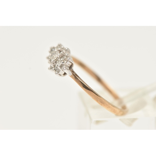 21 - A 9CT GOLD DIAMOND DRESS RING, designed as a central brilliant cut diamond flanked by horizontal bag... 