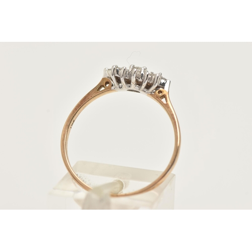 21 - A 9CT GOLD DIAMOND DRESS RING, designed as a central brilliant cut diamond flanked by horizontal bag... 