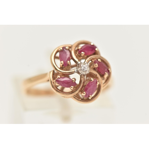 22 - A 9CT GOLD RUBY AND DIAMOND RING, designed as a central brilliant cut diamond, surrounded by marquis... 