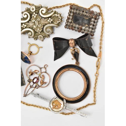 24 - A SELECTION OF JEWELLERY, to include an early 20th century openwork amethyst set pendant, a cut stee... 