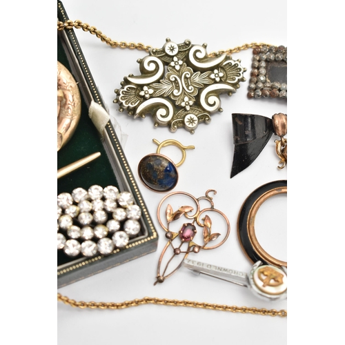 24 - A SELECTION OF JEWELLERY, to include an early 20th century openwork amethyst set pendant, a cut stee... 