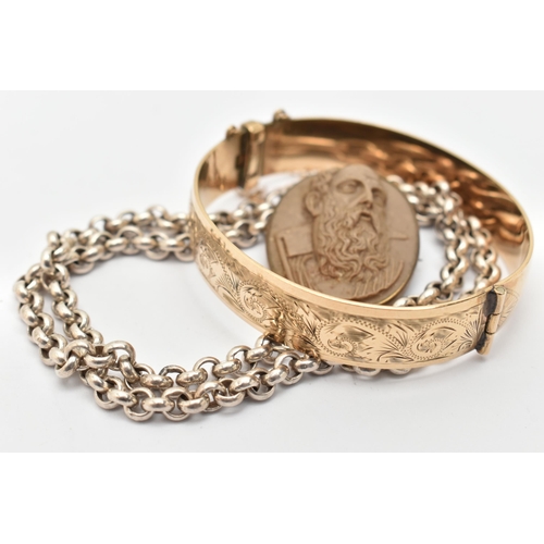 26 - THREE ITEMS OF JEWELLERY, to include a rolled gold bangle with engraved scrolling decoration to the ... 