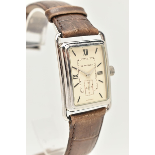 28 - A GENTLEMAN'S BURBERRY WRISTWATCH, the rectangular cream coloured face with Roman numerals, a subsid... 