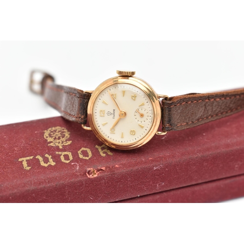 29 - A LADY'S TUDOR WATCH WITH 9CT GOLD HEAD, the white circular face with gold coloured Arabic numerals ... 