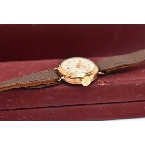 29 - A LADY'S TUDOR WATCH WITH 9CT GOLD HEAD, the white circular face with gold coloured Arabic numerals ... 