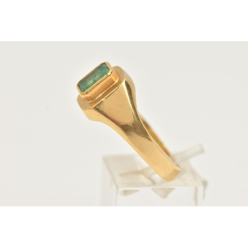 37 - A GENTS 18CT GOLD, EMERALD RING, set with an emerald cut emerald, measuring approximately in mount l... 