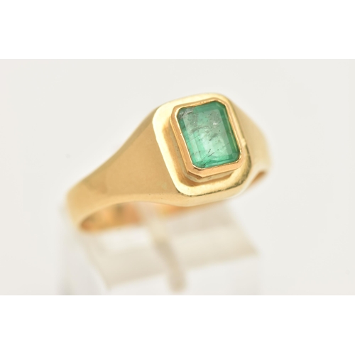 37 - A GENTS 18CT GOLD, EMERALD RING, set with an emerald cut emerald, measuring approximately in mount l... 